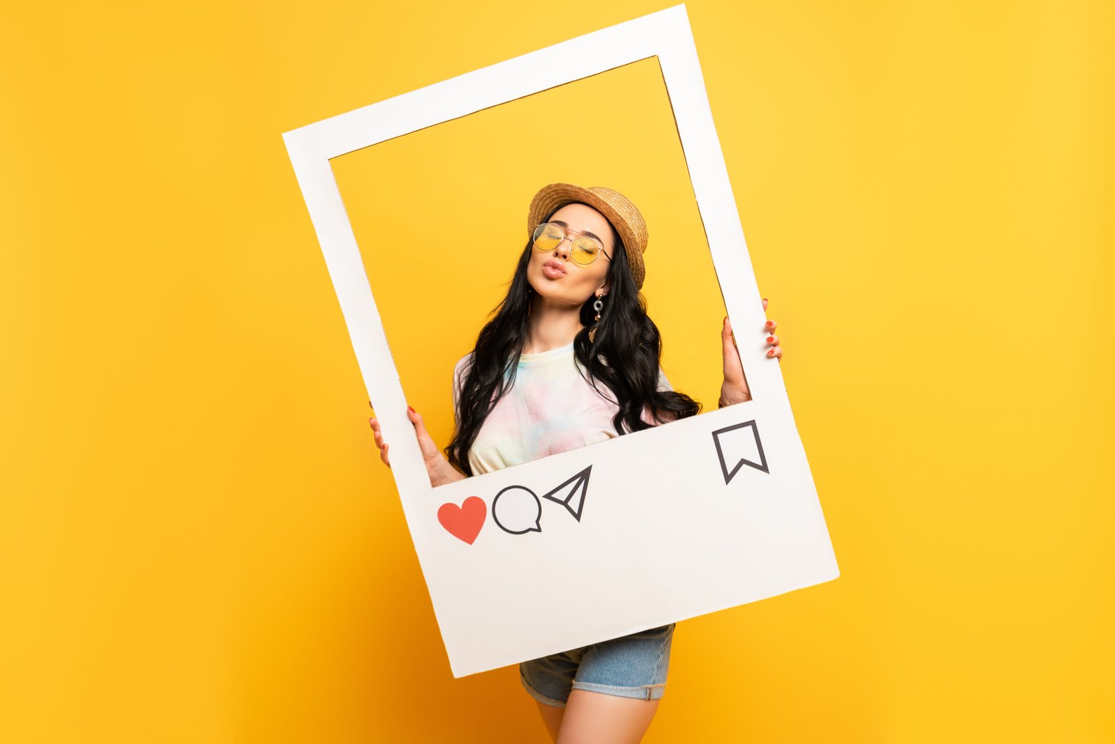 brunette girl in summer outfit posing pouting lips in social network frame on yellow background