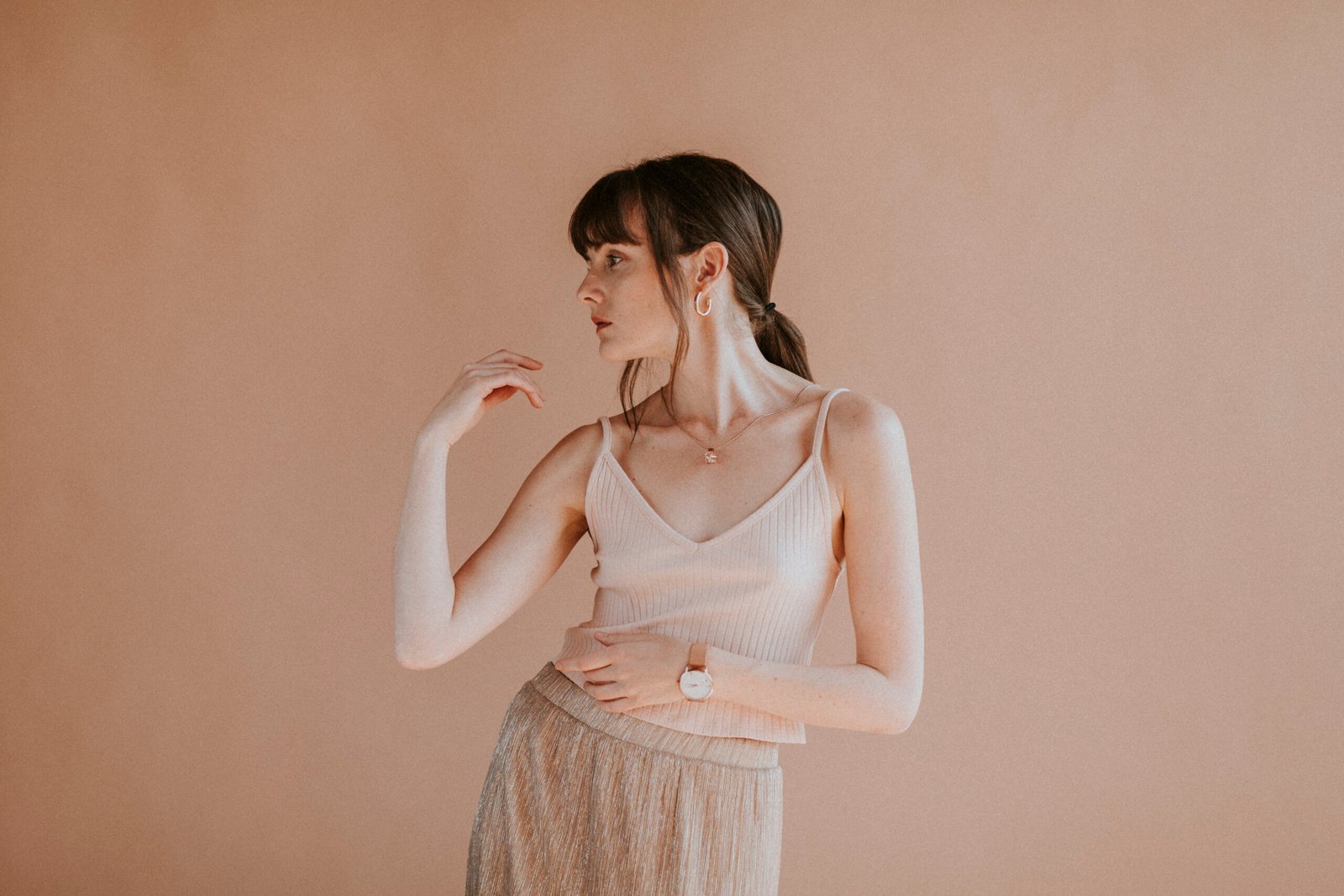 Woman in a light pink tank top